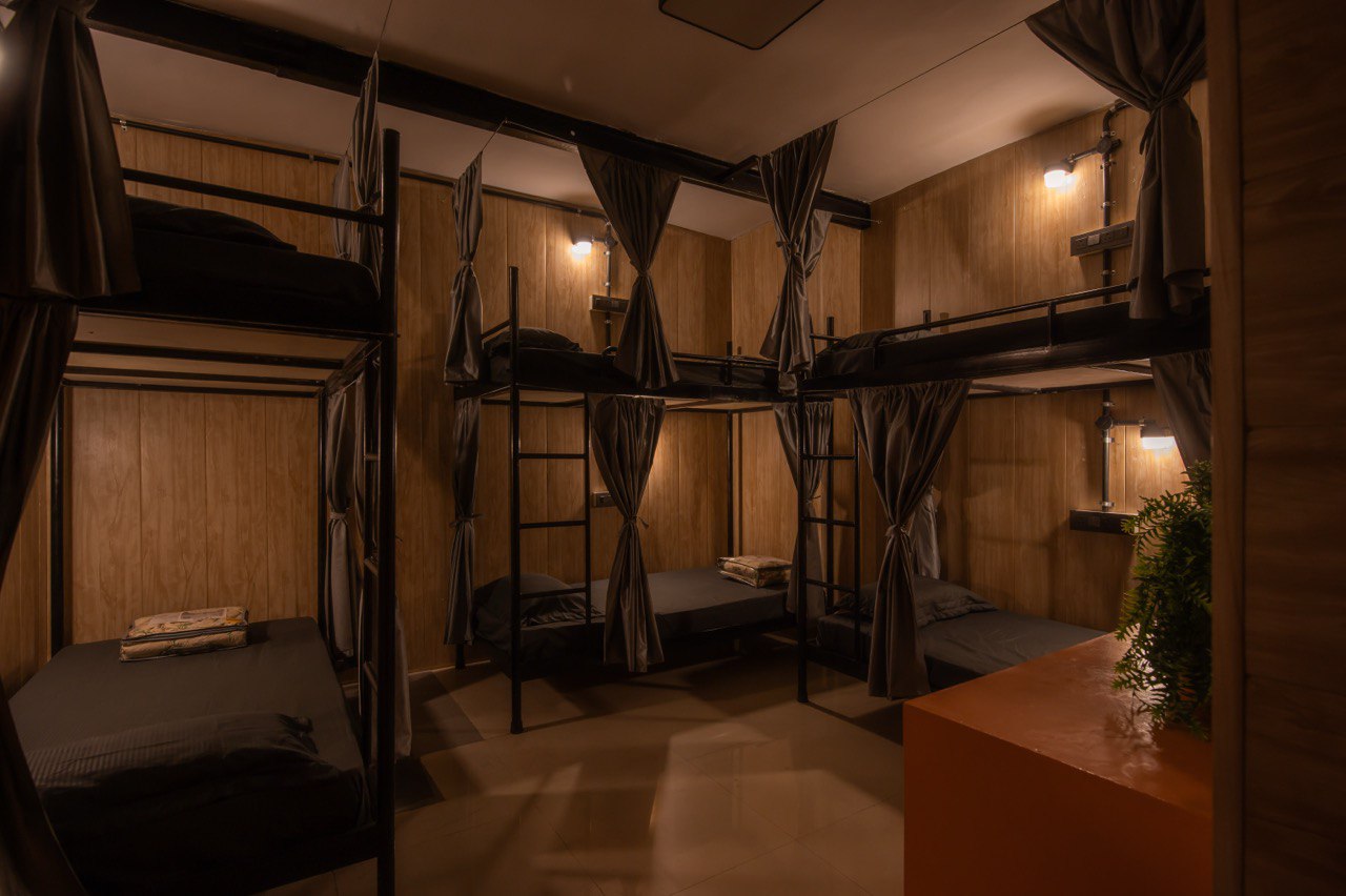 Dorm room at night — warm lighting, bunk beds