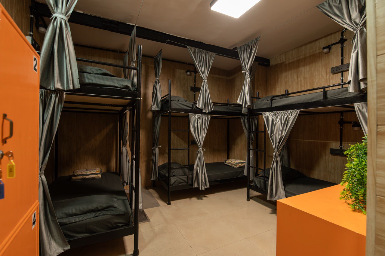 Ghumakkads dorm room — bunk beds with privacy curtains